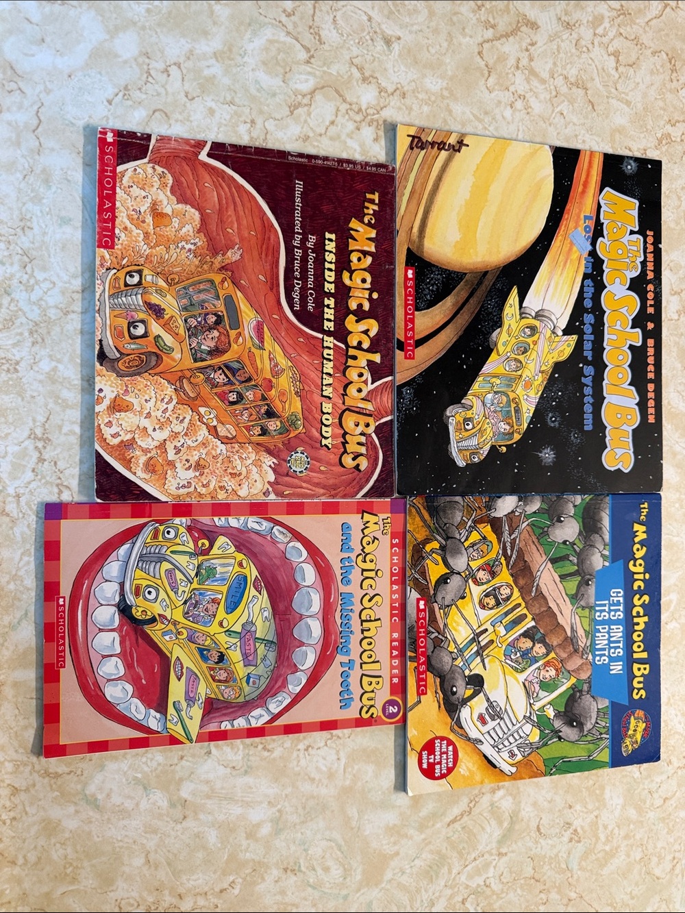Scholastic The Magic School Bus Book Set - Yellow, Red, Blue, Black Covers